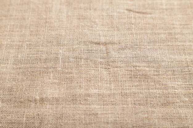 Fragmento de tejido de lino áspero Vista lateral fondo textil natural