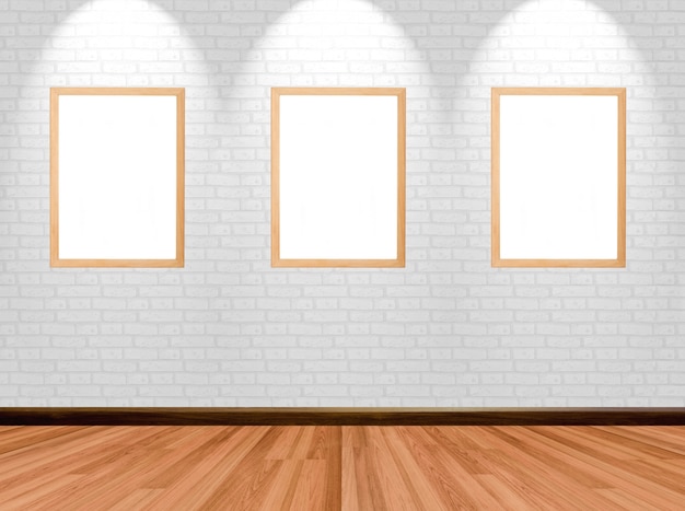 Frames vazios no fundo da sala com a parede e o projector de madeira de tijolo do assoalho.