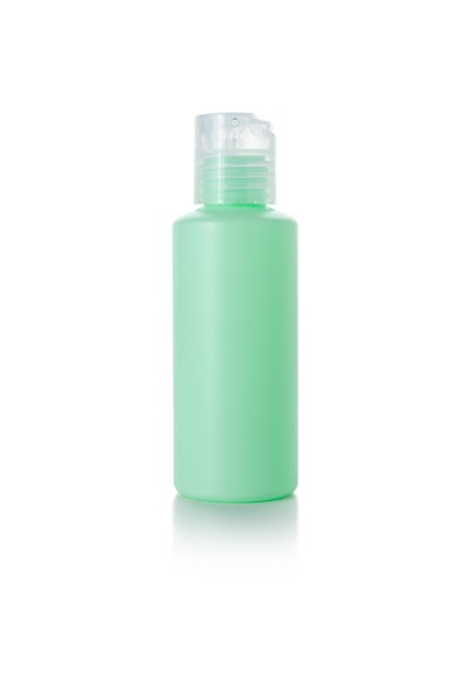 frasco de cuidado de la piel verde sobre fondo blanco