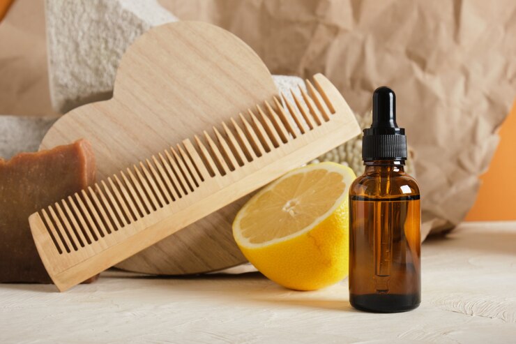 Foto frasco de vidro marrom com conta-gotas para soro ou óleo cosmético em um fundo claro, conceito de cuidado corporal ecologicamente correto