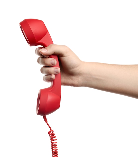 Foto frau mit rotem schnurgebundenem telefonhörer auf weißem hintergrund nahaufnahme hotline-konzept