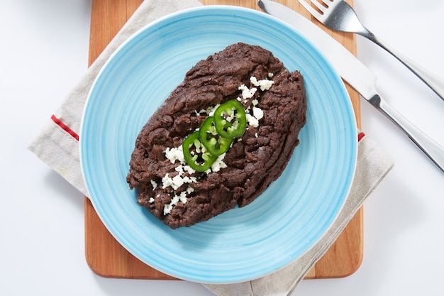 Foto frijoles negros refritos comida típica mexicana