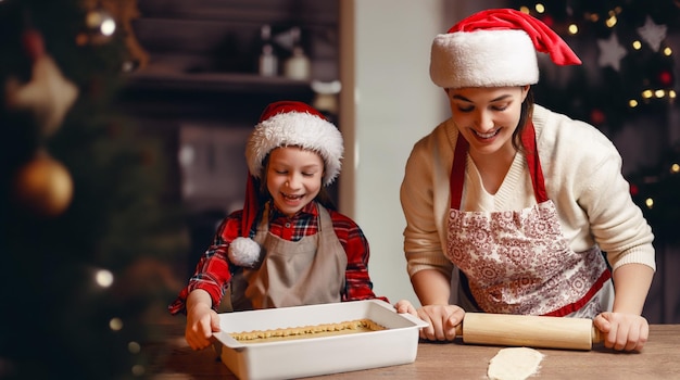 Foto frohe weihnachten und frohe feiertage familienvorbereitung weihnachtsessen mutter und tochter kochen kuchen