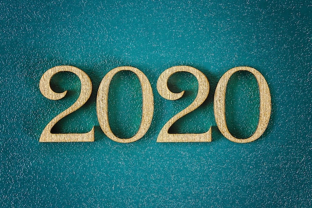 Frohes neues Jahr 2020. Kreativer Text Frohes neues Jahr 2020 in gold Holzbuchstaben geschrieben.