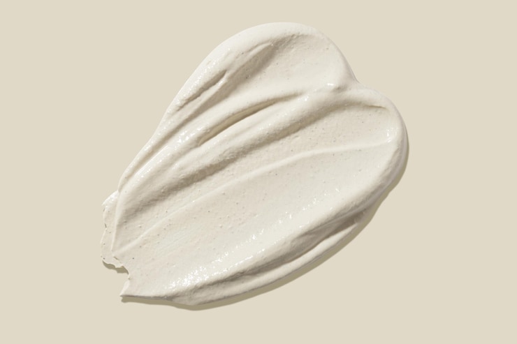 Foto frote el frotis sobre un fondo beige textura de belleza muestra de un producto cosmético