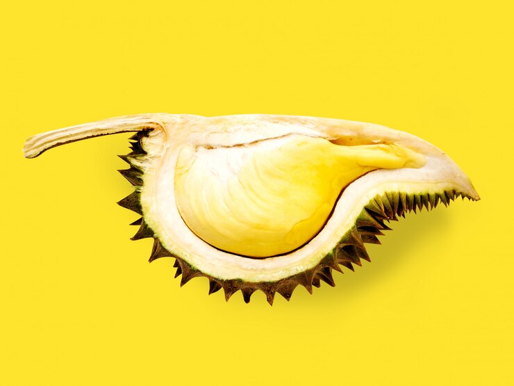 Foto fruta durian isolada em fundo amarelo