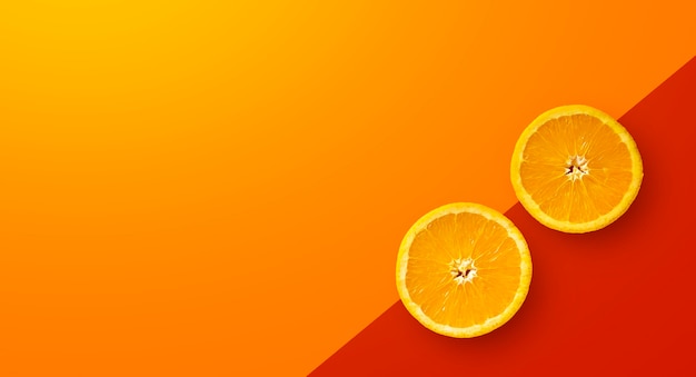 Fruta laranja em fundo amarelo e vermelho