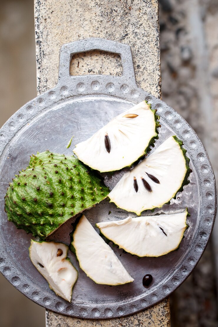 Foto fruta tropical da guanabana em um fundo de concreto