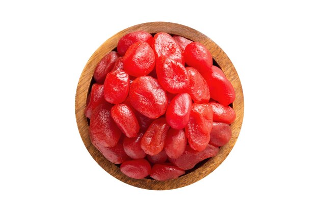 Foto frutas confitadas com açúcar em tigela de madeira isoladas em fundo branco comida vegana vista superior