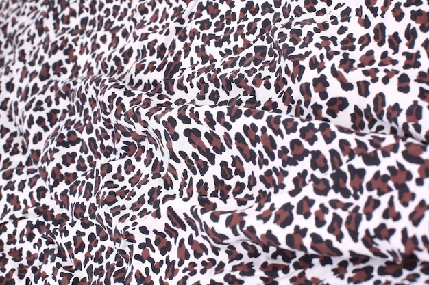 Foto fundo abstrato composto por tecido com estampa de leopardo. o conceito de criatividade