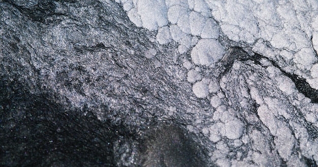 Fundo abstrato congelado neve rocha superfície fria monocromático preto branco brilhante espuma áspera