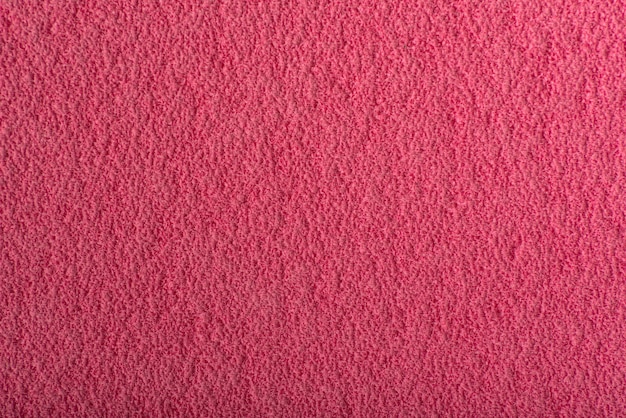 Fundo abstrato da framboesa. Superfície rosa texturizada áspera.