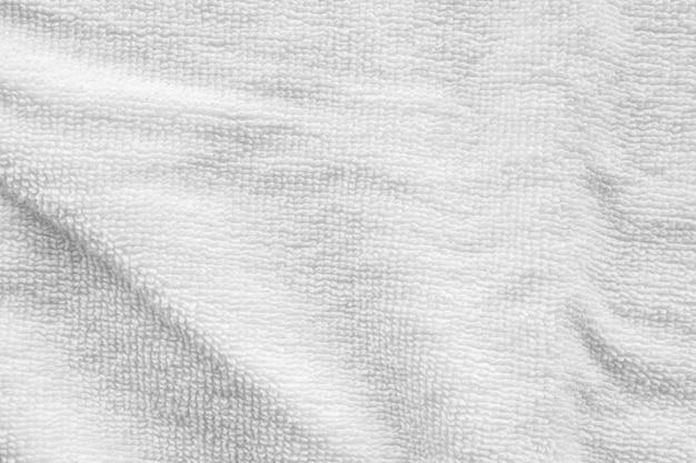 Fundo abstrato da textura da toalha de algodão branco do close up