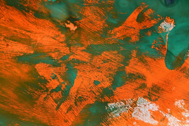 Fundo abstrato de verde sobre tinta laranja