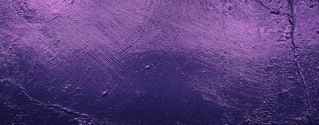 Fundo abstrato roxo da parede de concreto do cimento preto da textura