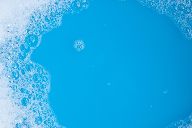Fundo azul bolha de espuma detergente