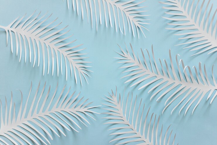 Foto fundo azul com penas de papel branco espetado
