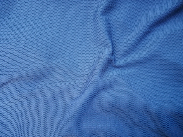 Foto fundo azul da textura da tela de seda, roupa do sportswear