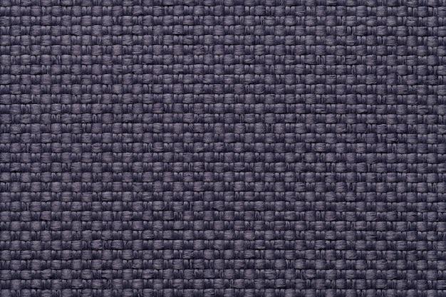 Fundo azul escuro têxtil com padrão quadriculado, closeup estrutura da macro de tecido