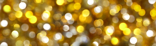 Foto fundo bokeh abstrato dourado com luz dourada desfocada