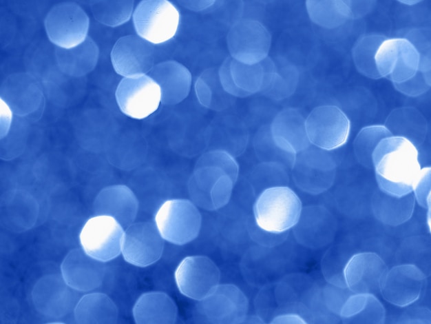 Fundo cintilante com bokeh feito da cor azul.