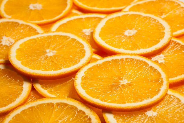 Fundo colorido de fatias de frutas cítricas laranja