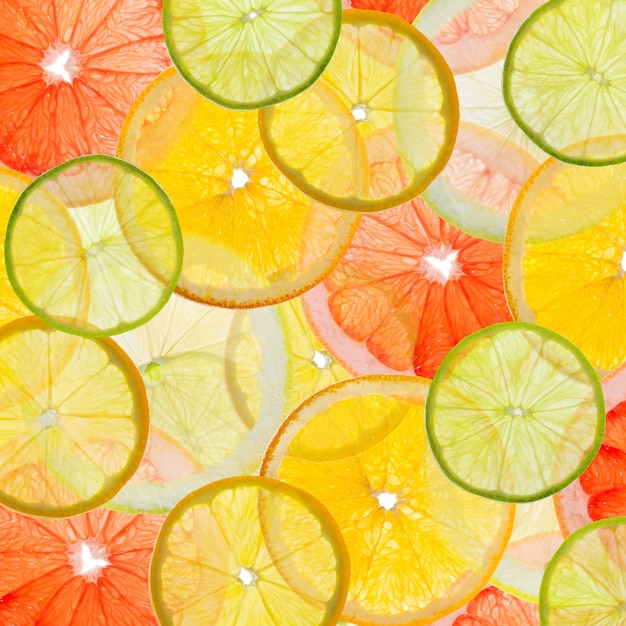 Foto fundo colorido de frutas feito de fatias de frutas cítricas