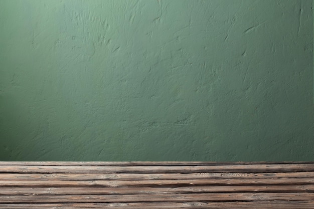 Fundo com mesa de madeira velha e parede verde