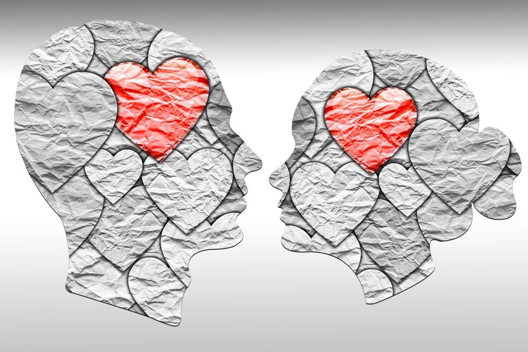 Foto fundo conceitual de amor e romance. silhuetas de um homem e uma mulher de papel amassado. dia dos namorados.