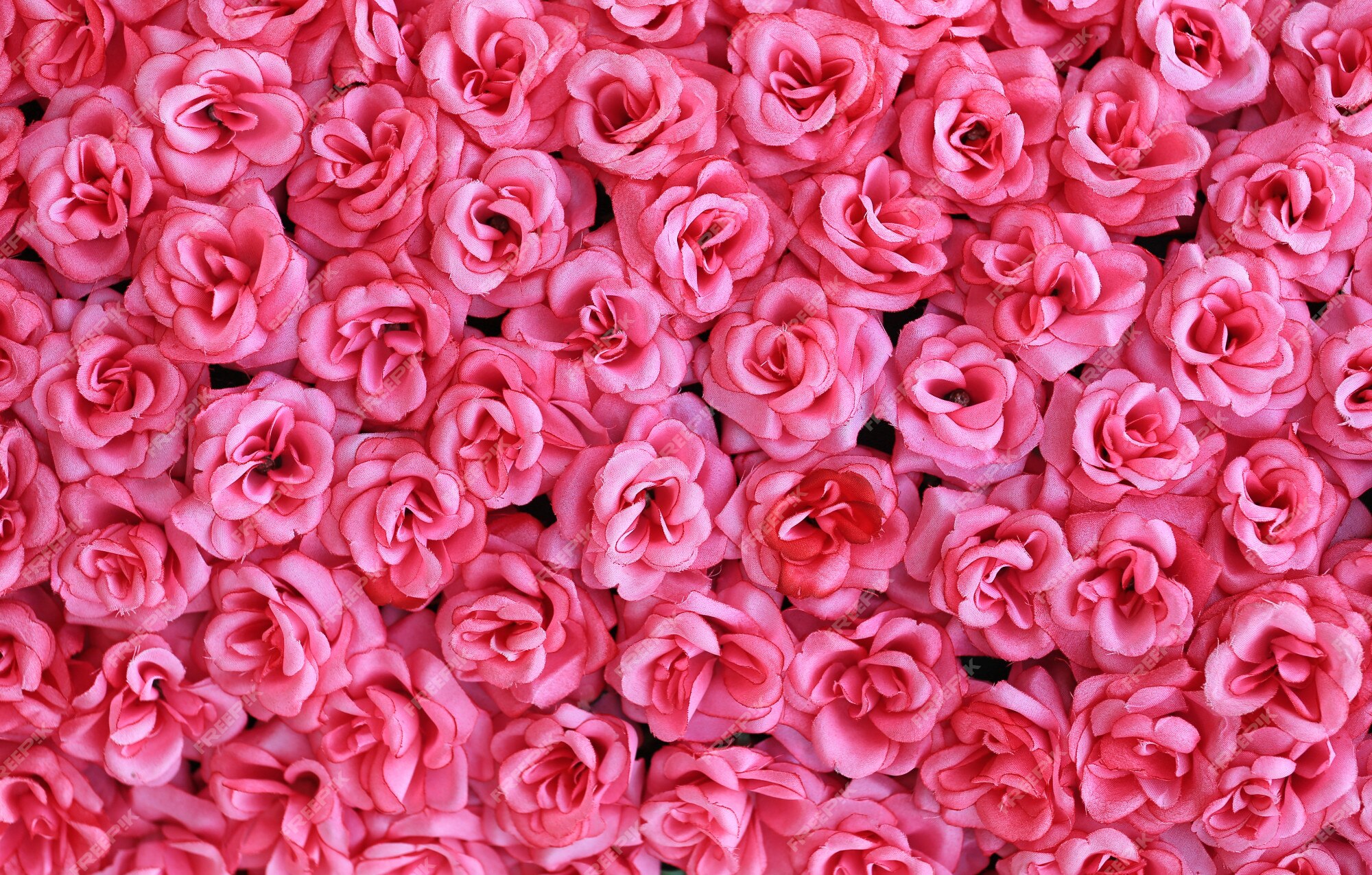 Fundo cor-de-rosa artificial das flores das rosas. | Foto Premium