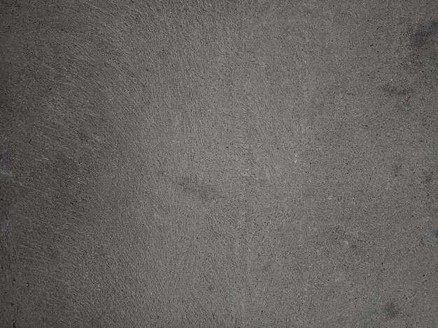 Fundo da parede de cimento escuro em estilo vintage para design gráfico ou papel de parede O padrão do piso de concreto é envelhecido em um conceito retrô