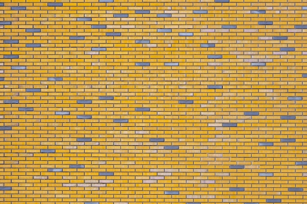 Foto fundo da parede de tijolos amarelos