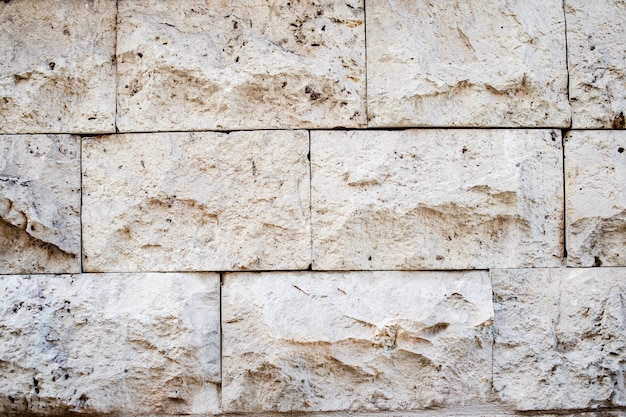 Fundo da textura do sumário do tijolo da luz natural. Bege de textura de parede de tijolo. parede de fundo de tijolo