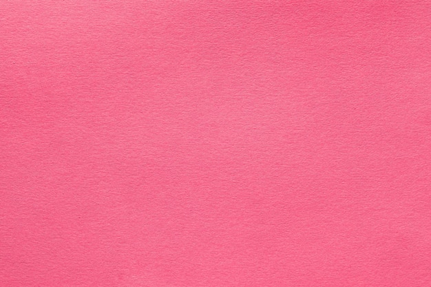 Fundo de arte abstrata de textura de feltro rosa coral Têxtil de lã de cor sólida Espaço para texto