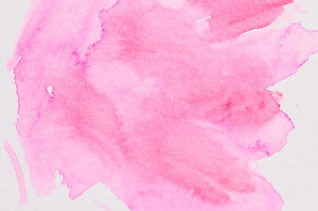 Fundo de arte líquida abstrata manchas translúcidas de aquarela rosa em papel branco