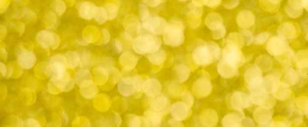 Fundo de bokeh dourado para o natal, luzes redondas desfocadas e raios solares, sobreposição de flare