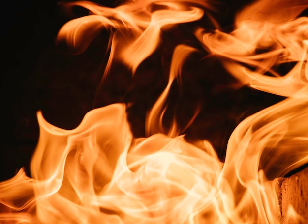 Foto fundo de chamas de fogo e laranja texturizado e preto