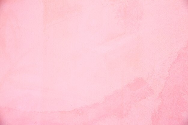 Foto fundo de concreto colorido rosa. textura da parede.