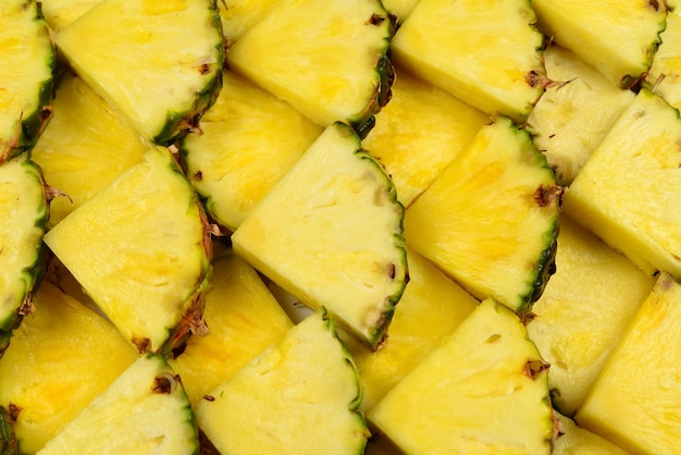 Foto fundo de fatias amarelas suculentas de abacaxi vista superior