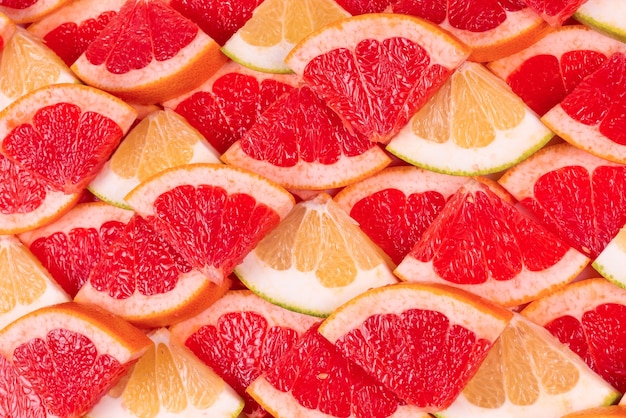 Fundo de fatias suculentas de pomelo e toranja.