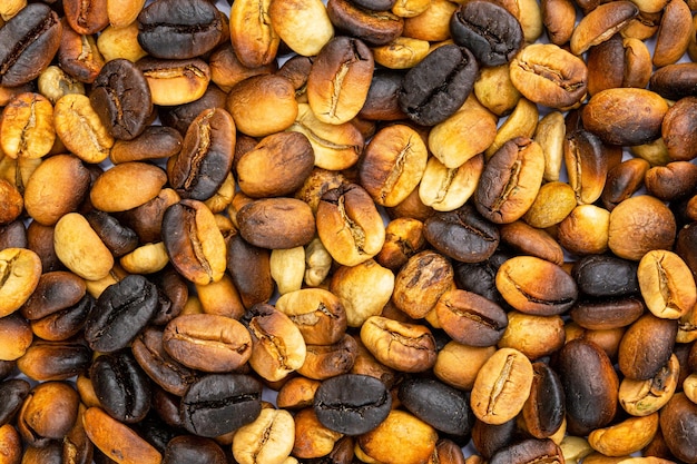 Foto fundo de grãos de café macro, grãos de café torrados podem ser usados como pano de fundo.