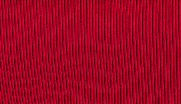 Fundo de lã tricotada em cores magnetas quentes com espaço de cópia