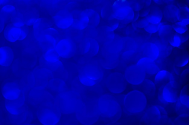 Fundo de luzes azuis de brilho abstrato. desfocado. Natal