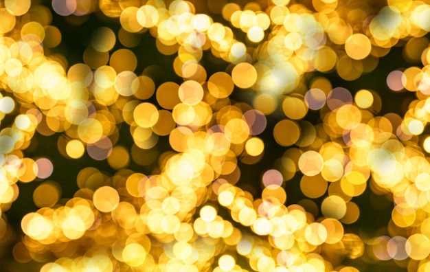 Fundo de luzes de Natal de guirlanda dourada amarela turva Bokeh de Natal desfocado com lâmpadas redondas desfocadas