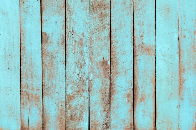 Fundo de madeira da praia do vintage - prancha de madeira resistida velha pintada na cor pastel de azul de turquesa.