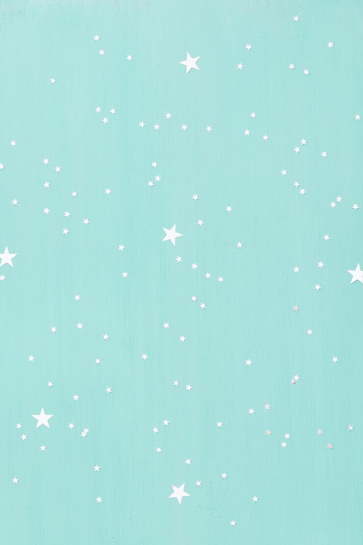 Fundo de madeira turquesa com pequenas estrelas de prata brilhantes.