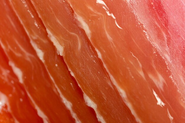 Fundo de mercearia de carne cortando jamon