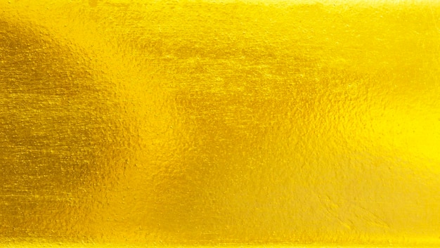 Fundo de metal dourado escovado ou textura de aço escovado