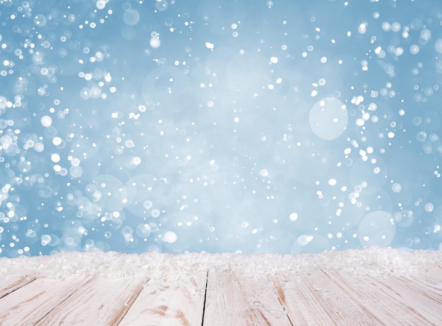 Foto fundo de natal com mesa de madeira branca coberta por neve