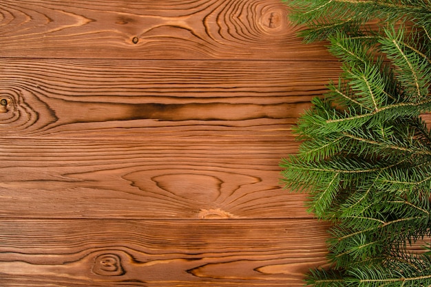 fundo de natal ramos de abeto em textura de madeira natural